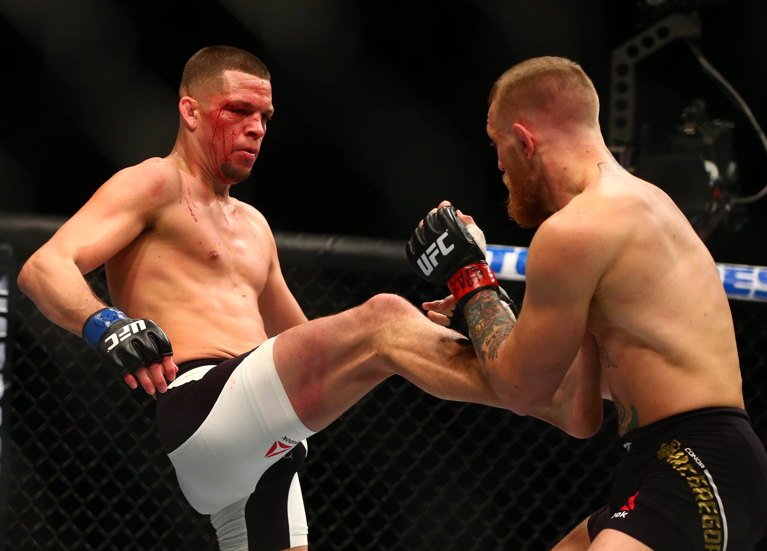 MMA: UFC 196-McGregor vs Diaz, March 5, 2016; Las Vegas, NV, USA; Nate Diaz lands a kick against Conor McGregor during UFC 196 at MGM Grand Garden ...