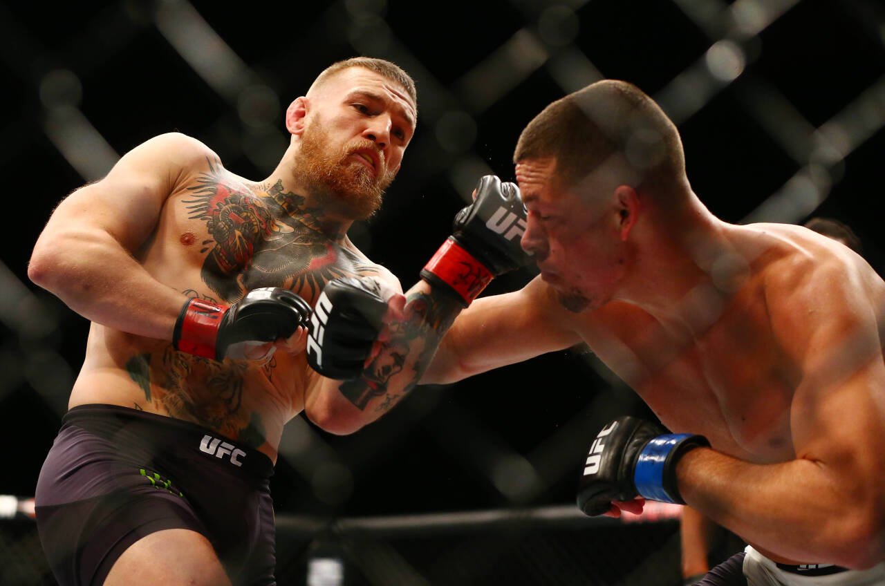 MMA: UFC 196-McGregor vs Diaz, March 5, 2016; Las Vegas, NV, USA; Nate Diaz moves in with a punch against Conor McGregor during UFC 196 at MGM Gran...
