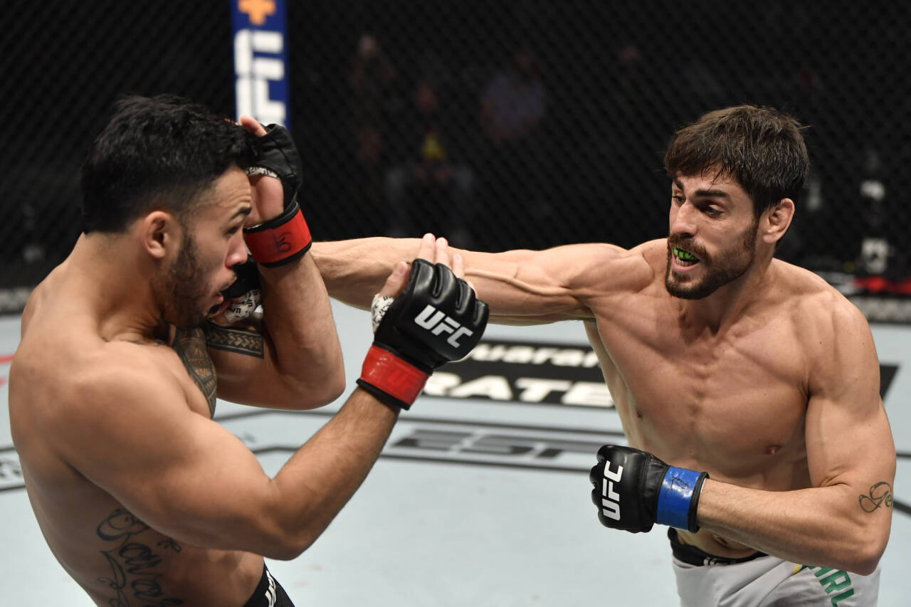 MMA: UFC 257, Jan 23, 2021; Abu Dhabi, United Arab Emirates; Antonio Carlos Junior of Brazil punches Brad Tavares in a middleweight fight during th...