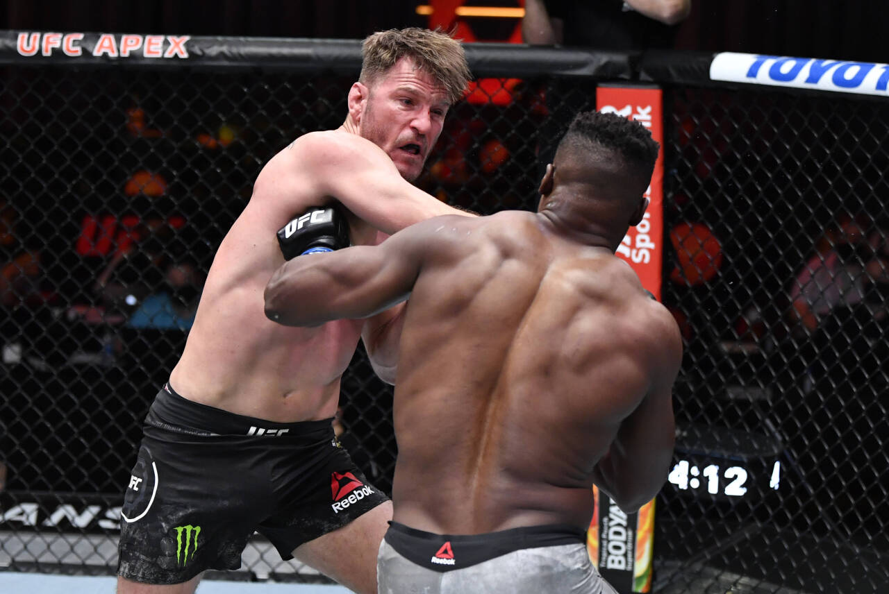 MMA: UFC 260, Mar 27, 2021; Las Vegas, NV, USA; Stipe Miocic punches Francis Ngannou of Cameroon in their UFC heavyweight championship fight during...