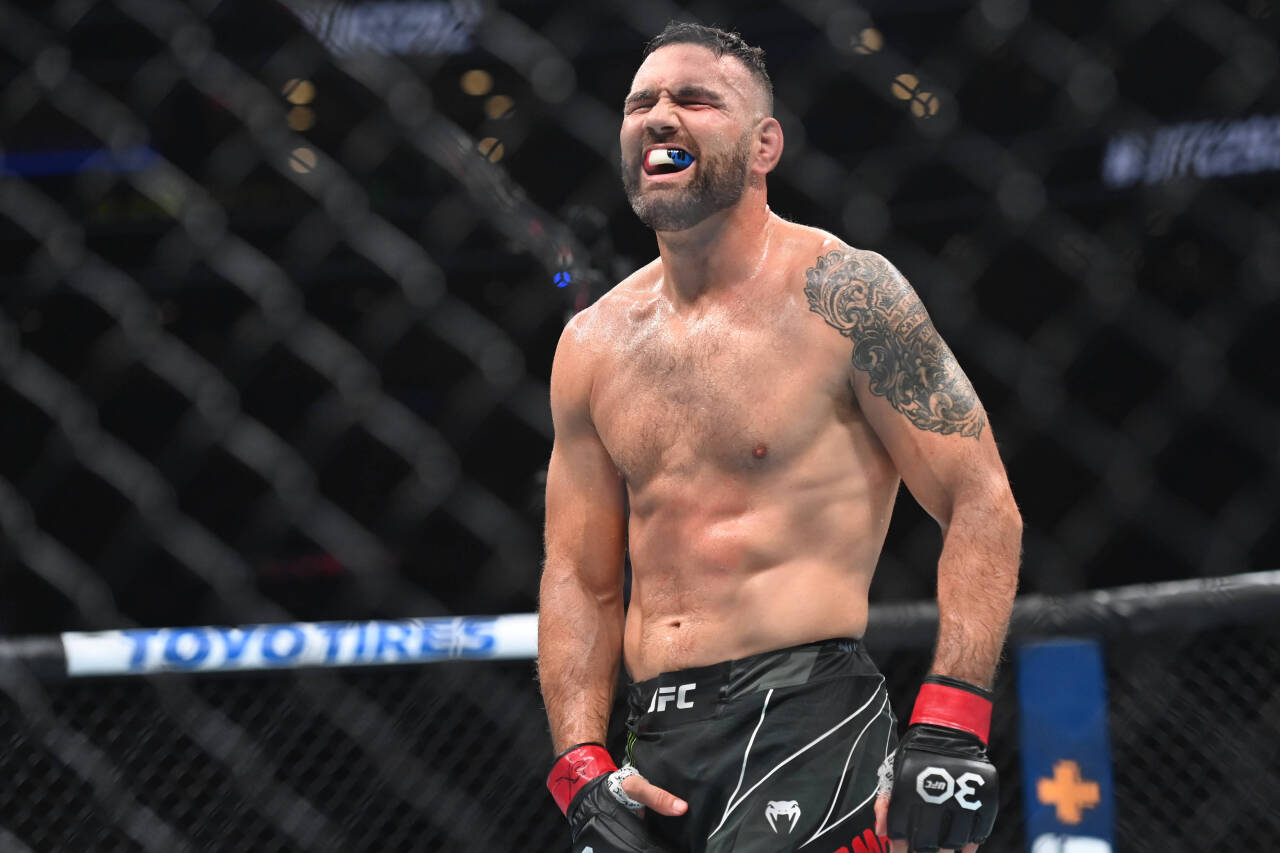 MMA: UFC 292 - Weidman vs Tavares Aug 19, 2023; Boston, MA, USA; Chris Weidman (red gloves) reacts in the fight against Bran Tavares (blue gloves) ...