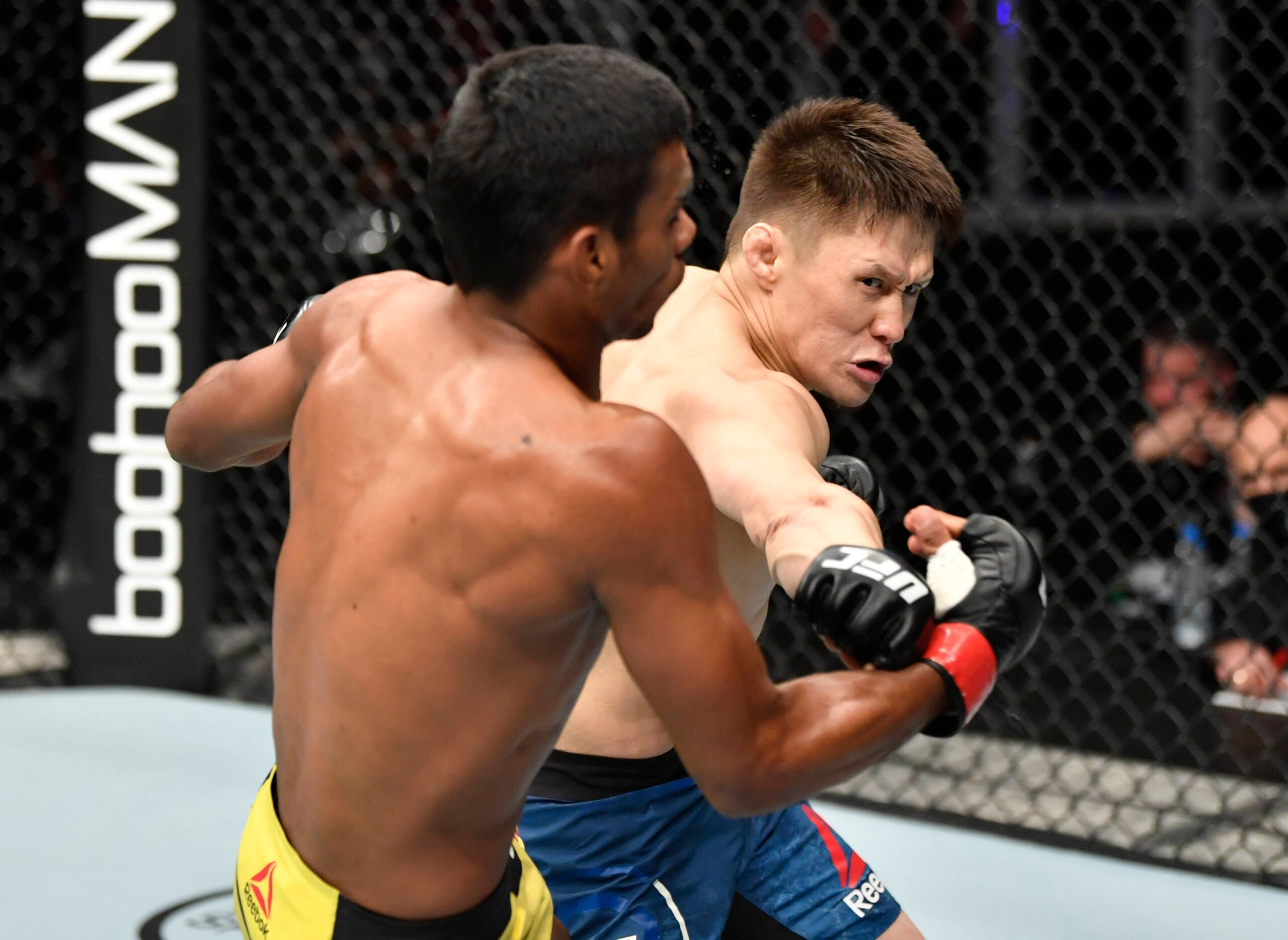 MMA: UFC Fight Island-UFC 251, July 12, 2020; Abu Dhabi, UAE; Zhalgas Zhumagulov of Kazakhstan punches Raulian Paiva of Brazil in their flyweight f...