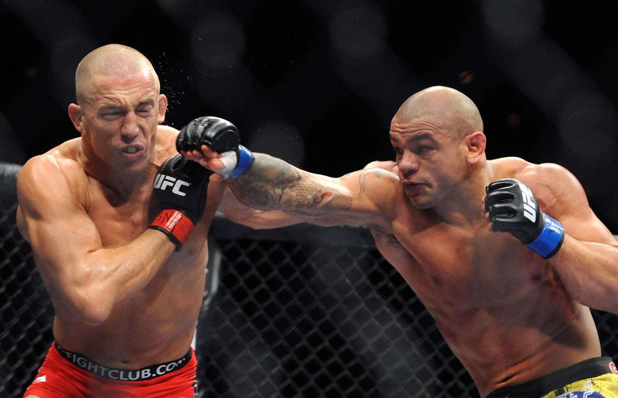 R-L: Thiago Alves of Brazil in action against Georges St-Pierre during the UFC Welterweight title bout at UFC 100 in Las Vegas PUBLICATIONxINxGERxS...