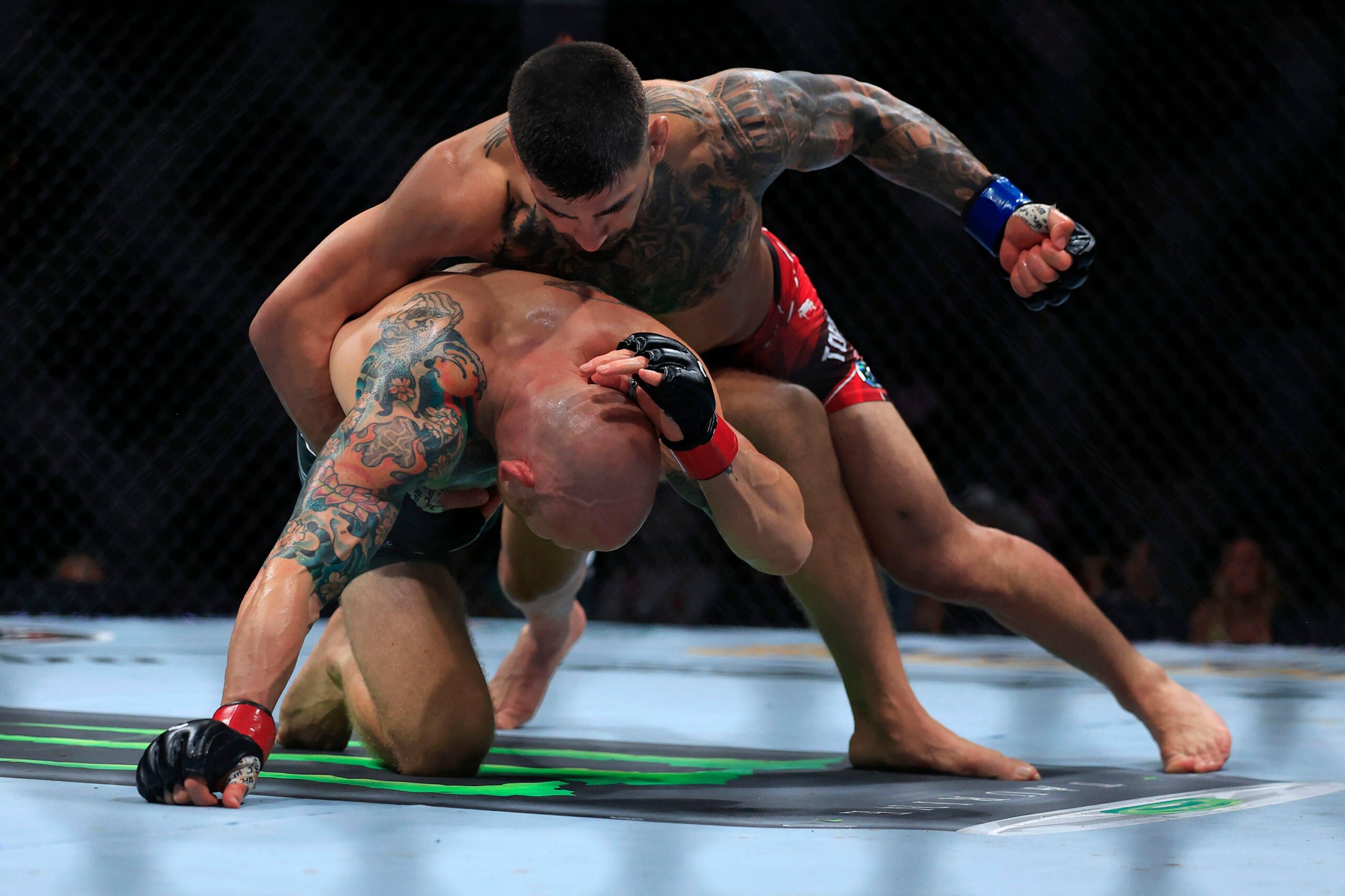 Syndication: Florida Times-Union Ilia Topuria punches Josh Emmett in a featherweight bout during the UFC Fight Night event Saturday, June 24, 2023 ...
