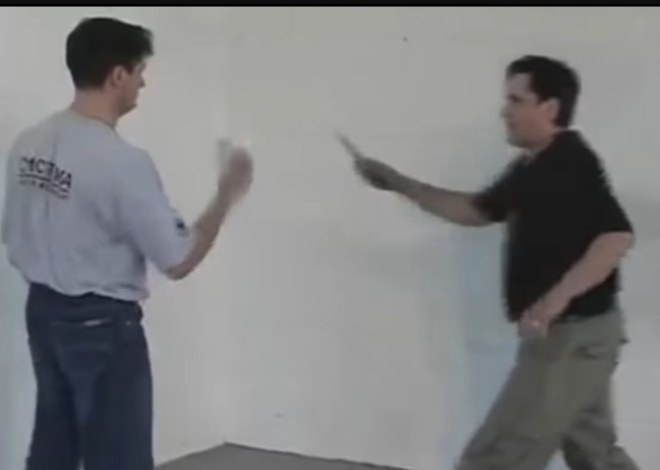 Systema instructor and training partner preparing for very bad knife disarm martial arts demonstration.