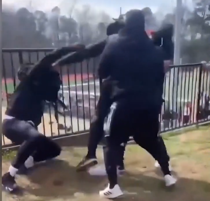 Staff at youth football event attempt to restrain NFL player Cam Newton during fight against various assailants
