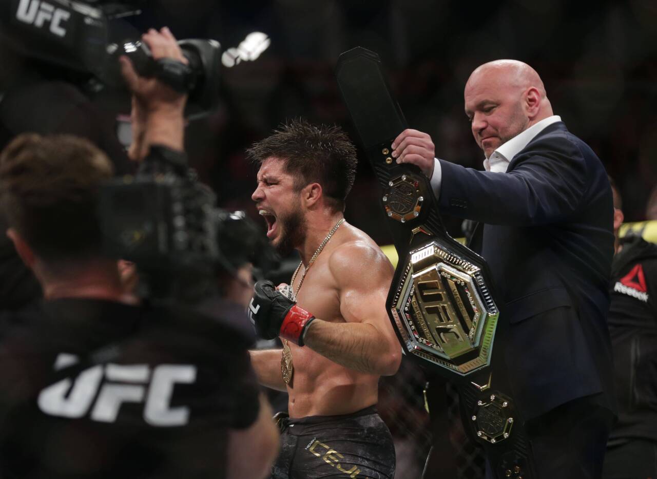 MMA: UFC 238-Cejudo vs Moraes, Jun 8, 2019; Chicago, IL, USA; UFC president Dana White presents Henry Cejudo (red gloves) with the championship bel...