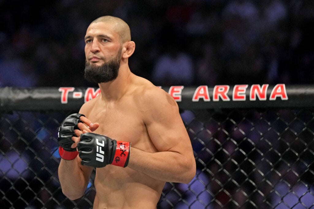 Khamzat Chimaev (red gloves) fights Kevin Holland (blue gloves) during UFC 279 at T-Mobile Arena.