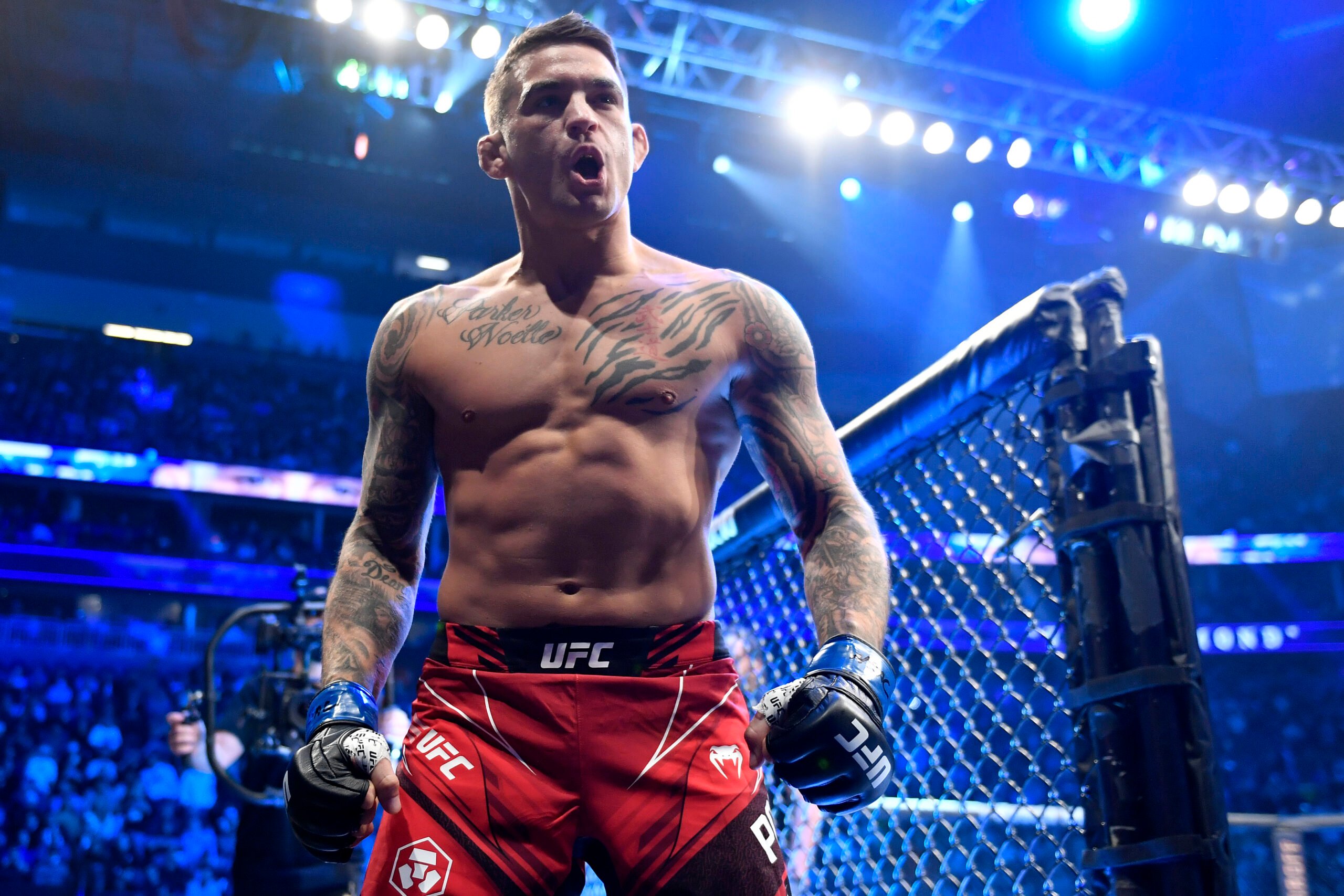 Dustin Poirier reacts as he enters the ring before his UFC lightweight championship bout against Charles Oliveira of Brazil during the UFC 269 on D...