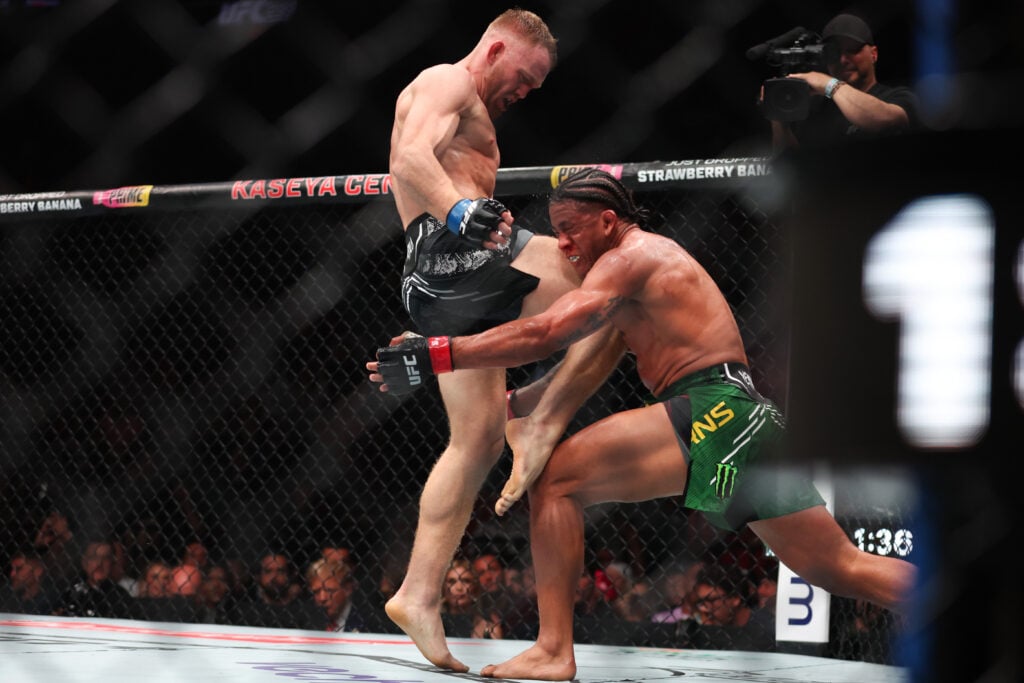Image of Jack Della Maddalena kneeing Gilbert Burns at UFC 299