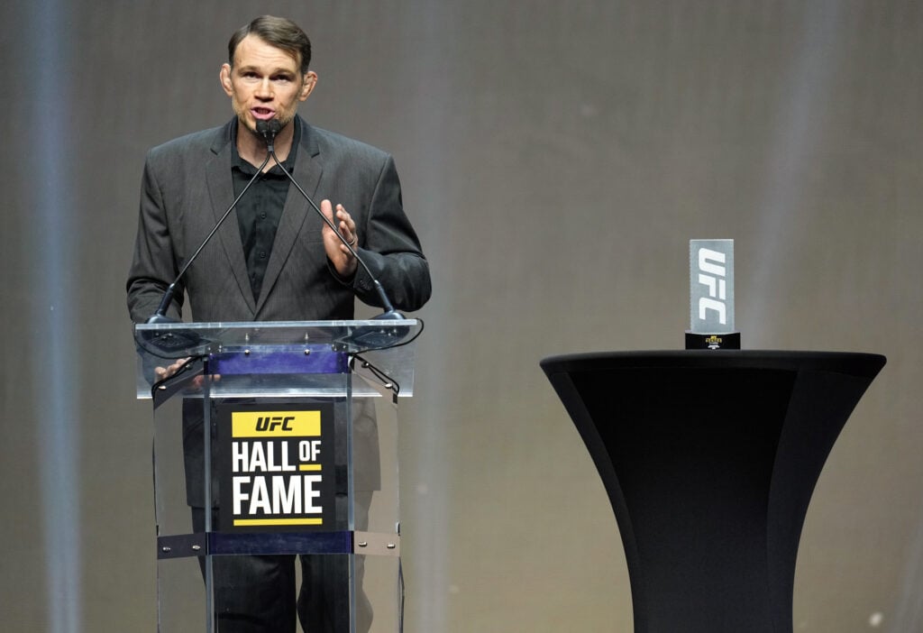 Forrest Griffin presents an award at the 2022 UFC Hall of Fame induction ceremony