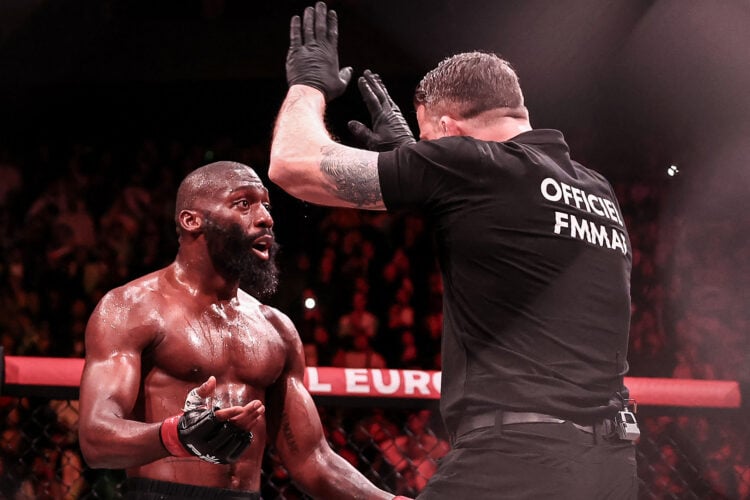 TOPSHOT - French-Cameroonian Cedric Doumbe (L) reacts as the referee stops the game during his welterweight bout against French Baysungur Baki Cham...