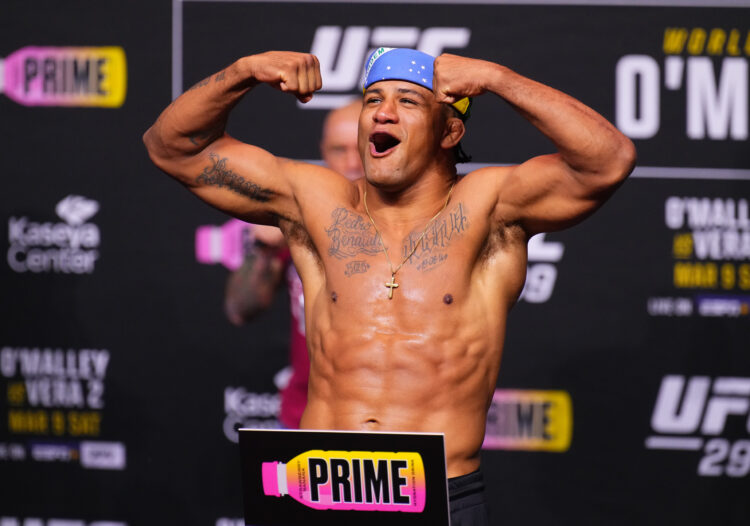 Gilbert Burns of Brazil poses on the scale during the UFC 299 ceremonial weigh-in at Kaseya Center on March 08, 2024 in Miami, Florida.