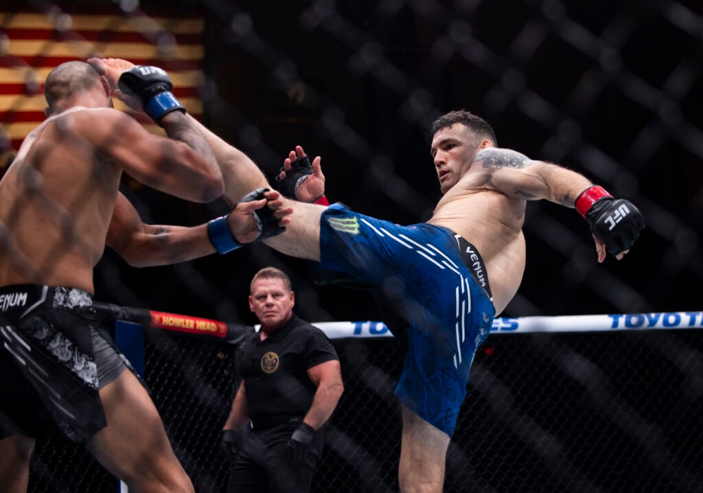 Chris Weidman throws a kick at Bruno Silva
