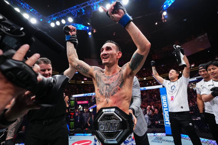 Max Holloway receives the BMF belt from Mark Coleman in the BMF championship fight during the UFC 300 event at T-Mobile Arena on April 13, 2024 in ...