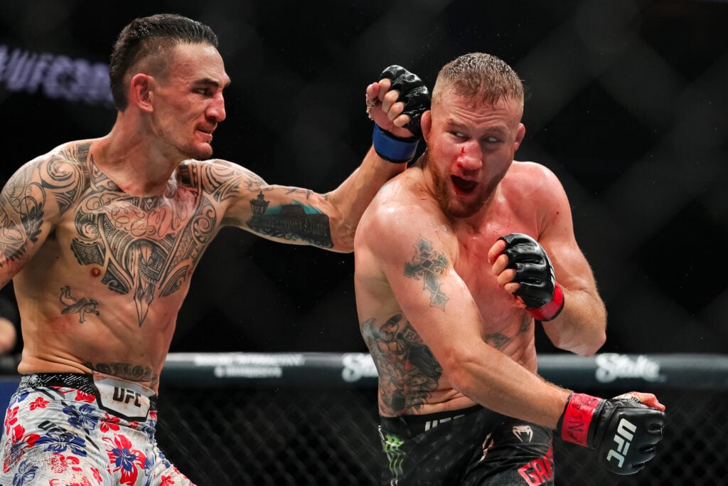 Justin Gaethje and Max Holloway exchange strikes during their BMF title fight at T-Mobile Arena on April 13, 2024 in Las Vegas, Nevada.