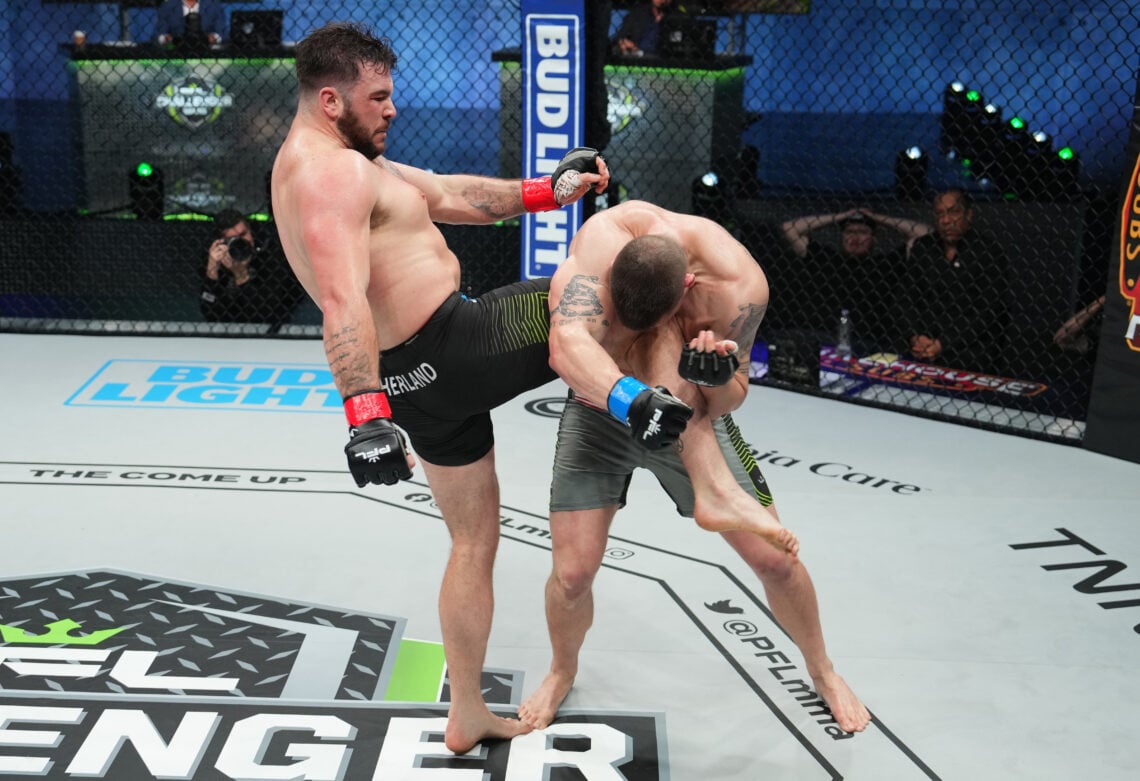Louie Sutherland in black shorts kicks Alton Meiks in grey shorts during a PFL MMA fight