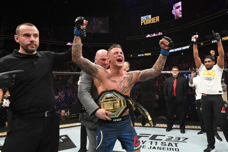 (L-R) UFC President Dana White places the interim lightweight championship belt on Dustin Poirier after defeating Max Holloway in their interim lig...