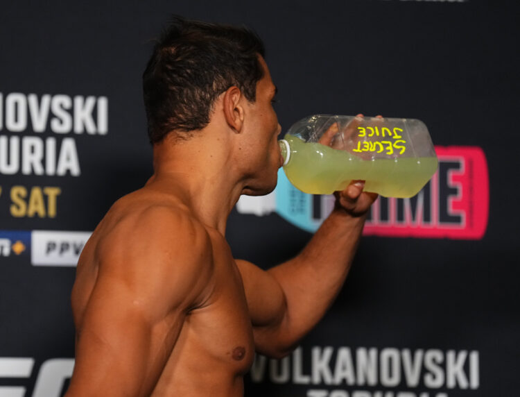 Paulo Costa of Brazil rehydrates after making weight during the UFC 298 official weigh-in at the Hyatt Regency Irvine on February 16, 2024 in Irvin...