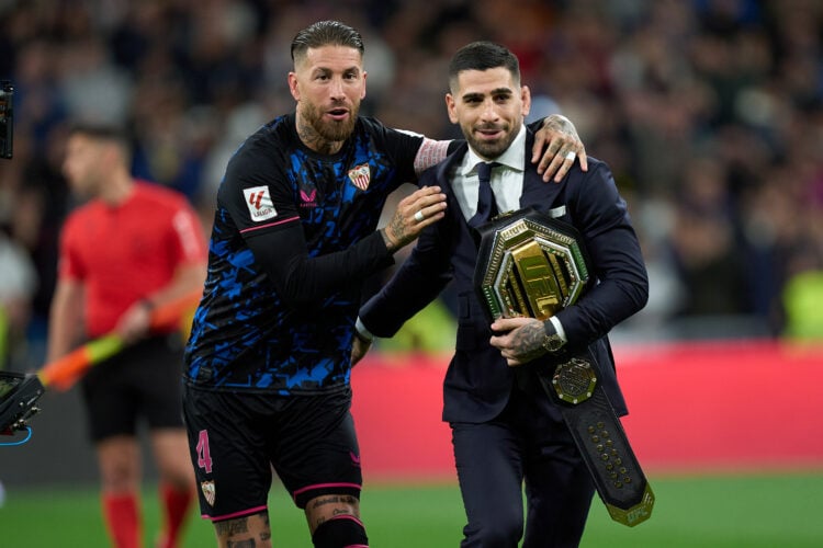 Ilia Topuria, UFC Featherweight Champion, interacts with Sergio Ramos of Sevilla FC on the pitch prior to the LaLiga EA Sports match between Real M...