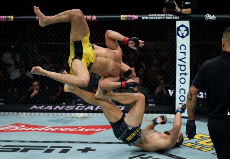 (L-R) Michel Pereira of Brazil flips to pass the guard of Ihor Potieria of Ukraine in a middleweight bout during the UFC 301 event at Farmasi Arena...