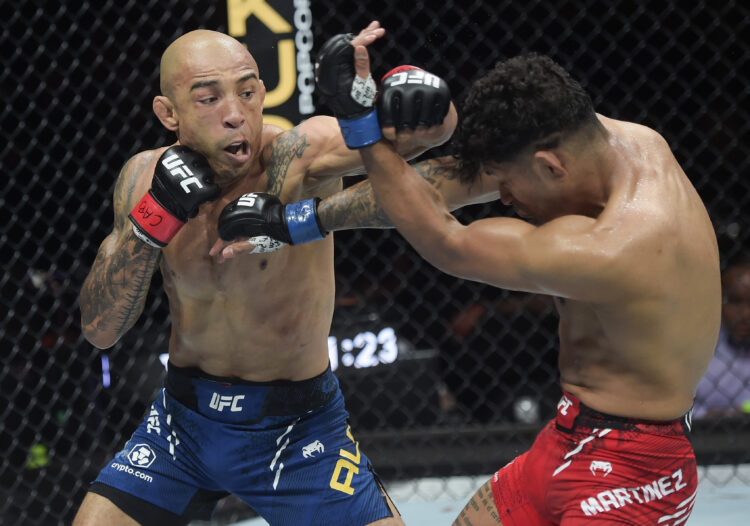 (L-R) Jose Aldo of Brazil punches Jonathan Martinez in a bantamweight bout during the UFC 301 event at Farmasi Arena on May 04, 2024 in Rio de Jane...