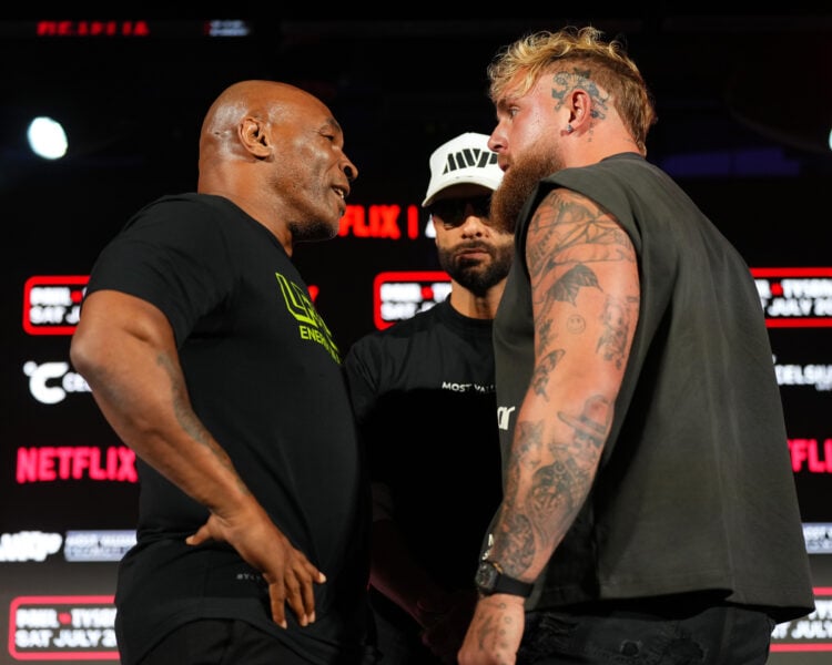 (L-R) Mike Tyson, Nakisa Bidarian and Jake Paul pose onstage during the Jake Paul vs. Mike Tyson Boxing match Arlington press conference at Texas L...