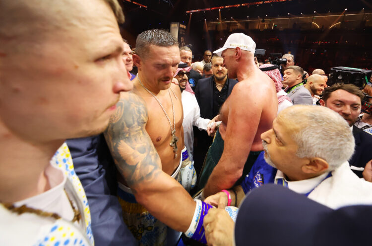 Oleksandr Usyk has his gloves removed following victory over Tyson Fury in the IBF, WBA, WBC, WBO and Undisputed Heavyweight titles' fight between ...