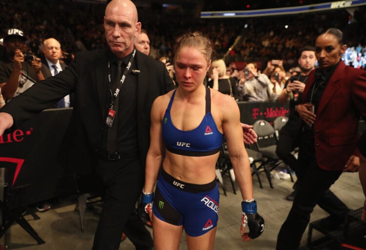 Ronda Rousey exits the Octagon after her loss to Amanda Nunes of Brazil in their UFC women's bantamweight championship bout during the UFC 207 even...