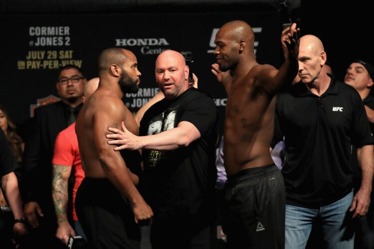 (L-R) Daniel Cormier poses with Jon Jones during the UFC 214 weigh-in at Honda Center on July 28, 2017 in Anaheim, California. Cormier is fighting ...