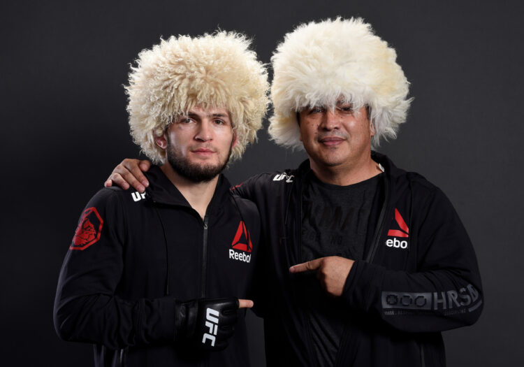 Khabib Nurmagomedov of Russia poses for a portrait backstage with coach Javier Mendez after his victory over Edson Barboza during the UFC 219 event...