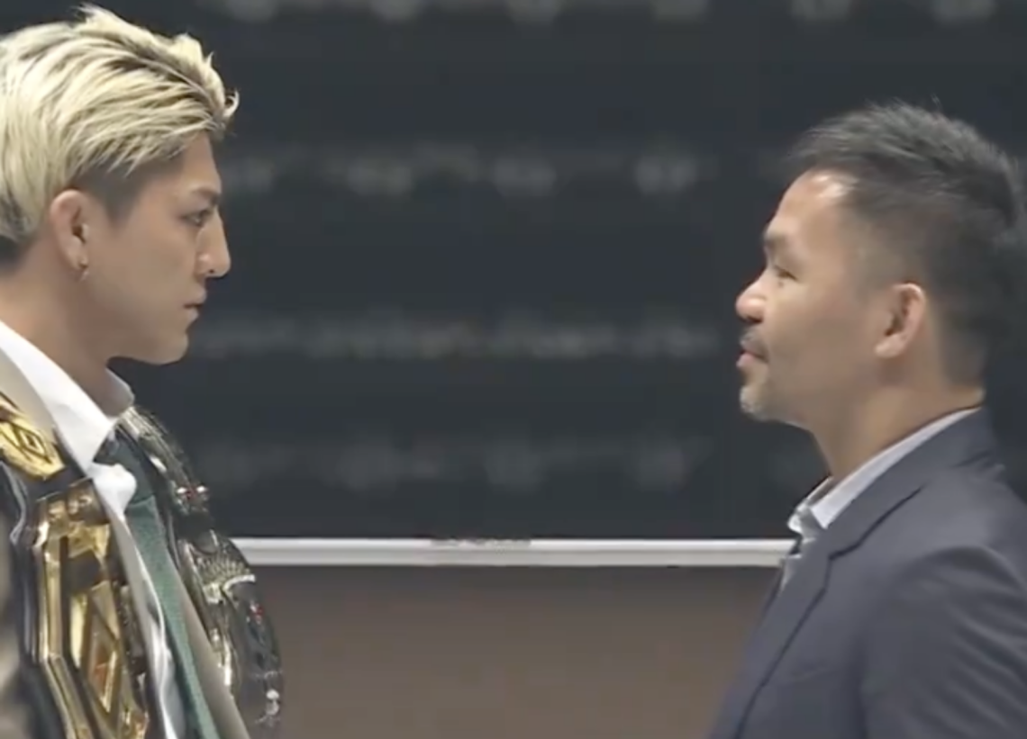Chihiro Suzuki with his RIZIN and KNOCK OUT belts, facing off with Manny Pacquiao