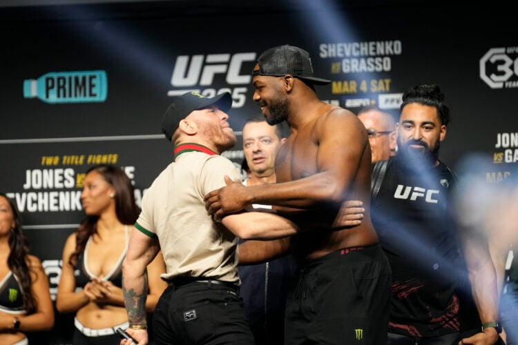 (L-R) Conor McGregor and Jon Jones share a moment on stage following the face-off at MGM Grand Garden Arena for UFC 285 -Jones vs Gane : Ceremonial...