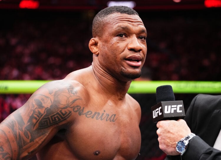 Jailton Almeida of Brazil reacts after his submission victory against Alexandr Romanov of Moldova in a heavyweight fight during the UFC 302 event a...