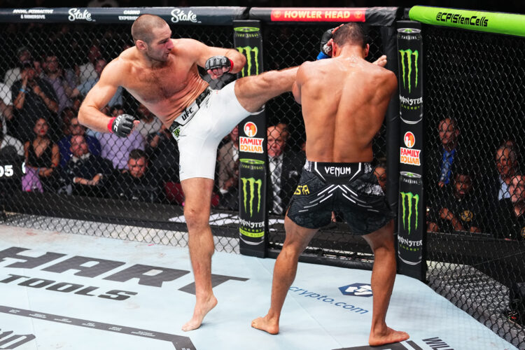 (L-R) Sean Strickland kicks Paulo Costa of Brazil in a middleweight fight during the UFC 302 event at Prudential Center on June 01, 2024 in Newark,...