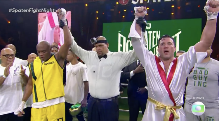 Anderson Silva and Chael Sonnen both have their hands raised as their exhibition boxing match ends in a draw