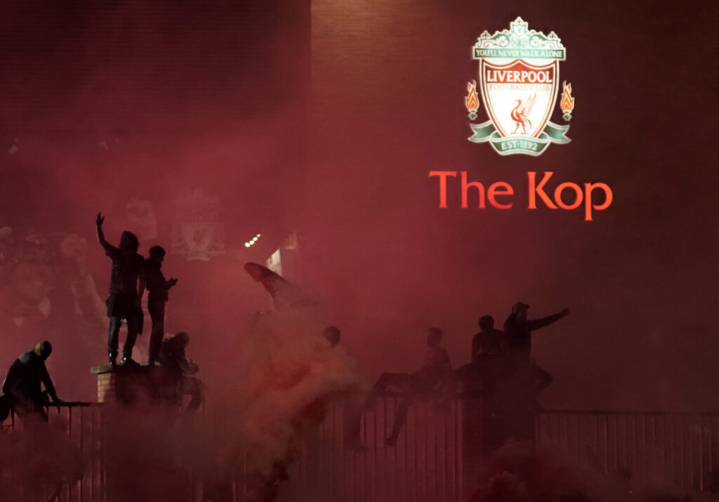 Fans Celebrate As Liverpool FC Lift The Premiership Trophy At Anfield