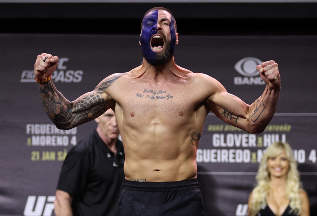 Paul Craig poses on the scales at the UFC 283 weigh-ins