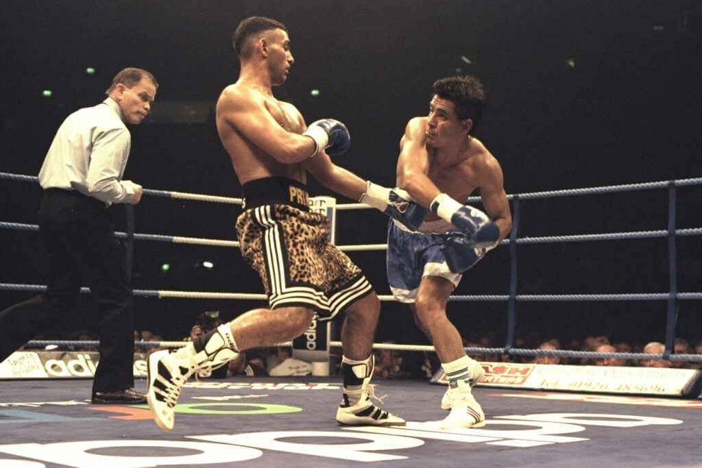 Remigio Molina of Argentina (right) misses with a right