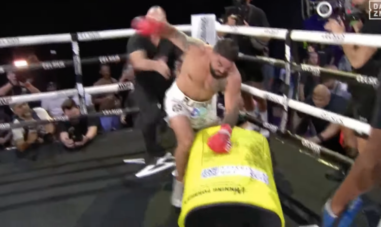 Mike Perry beating up Jake Paul's mascot at open workouts