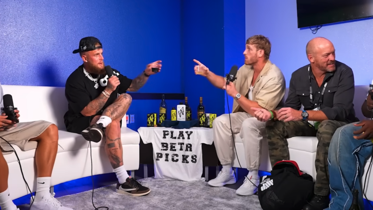 Logan Paul and Jake Paul sharing a post-fight drink