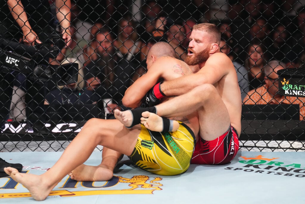 Jan Blachowicz controls Alex Pereira on the ground during their fight at UFC 291