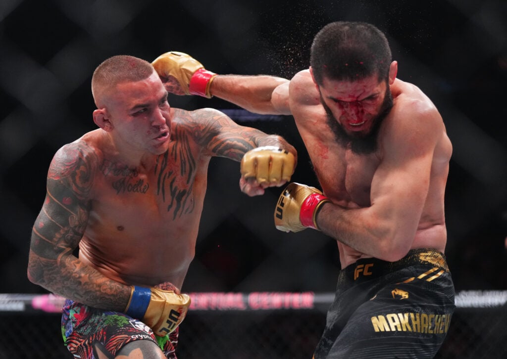 Dustin Poirier punching Islam Makhachev at UFC 302
