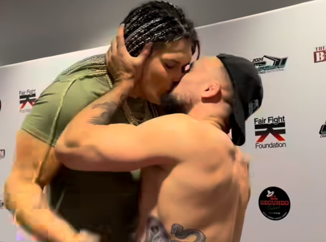 Craig Jones pulling in Gabi Garcia for a kiss