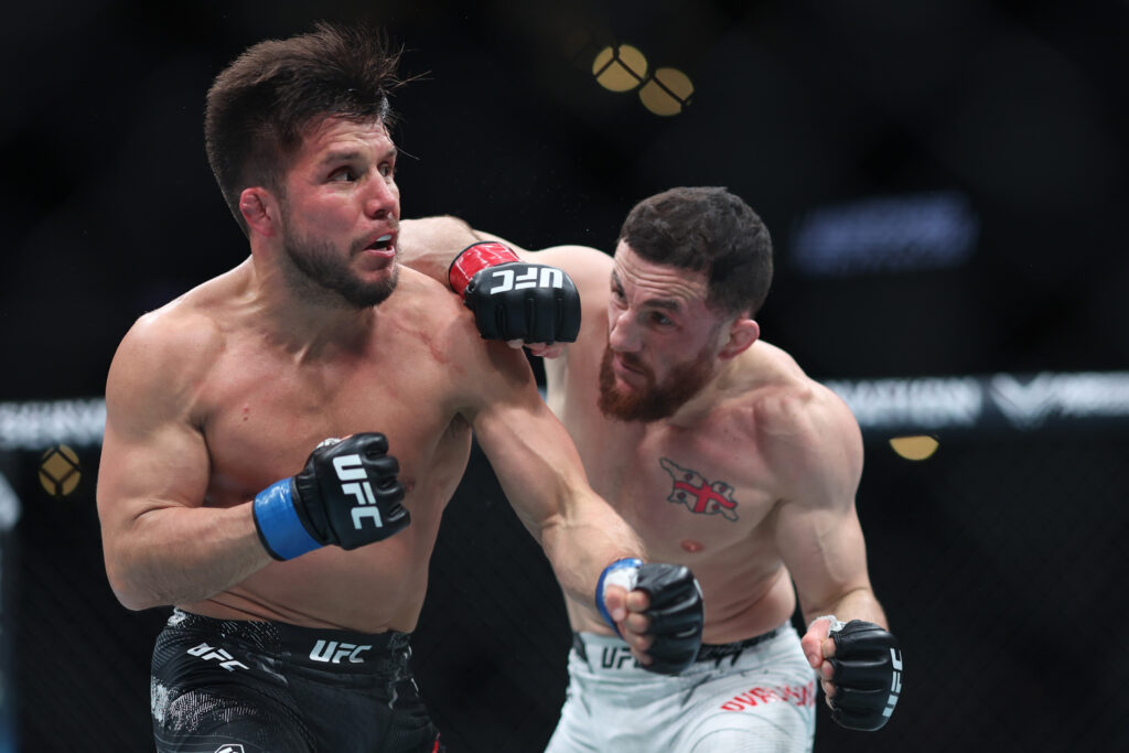 Merab Dvalishvili lands a punch on Henry Cejudo during their UFC 298 fight