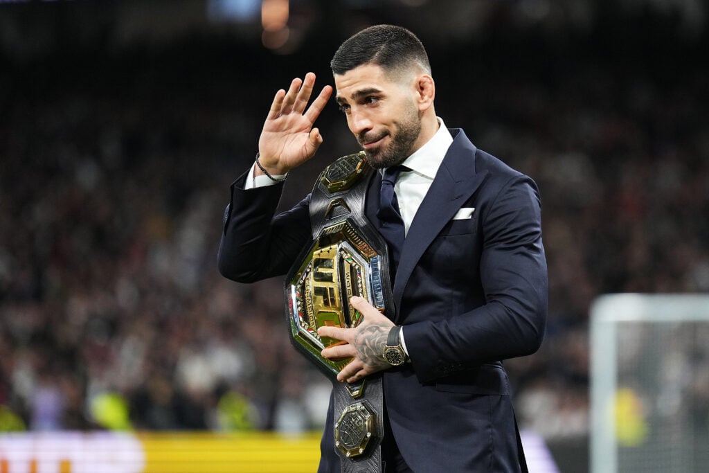 Ilia Topuria at a Real Madrid match with his UFC title