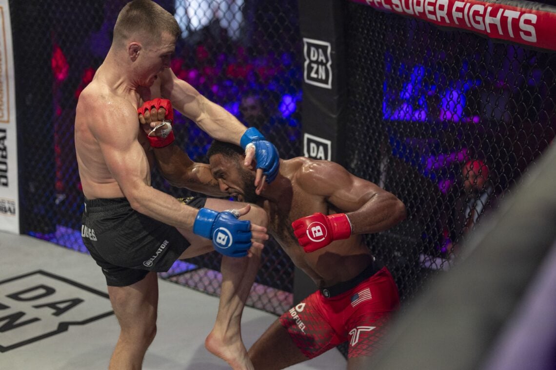 Paul Hughes knees AJ McKee during their PFL fight
