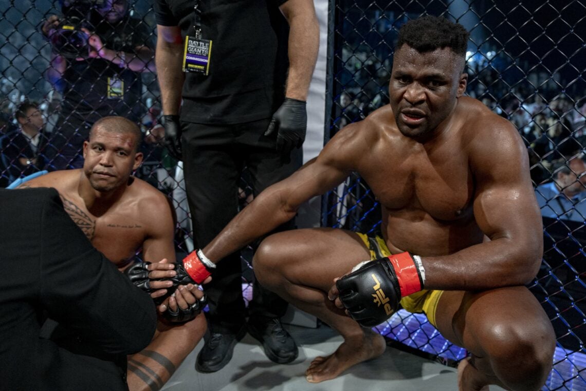 Renan Ferreira is consoled by Francis Ngnnou after getting KO'd
