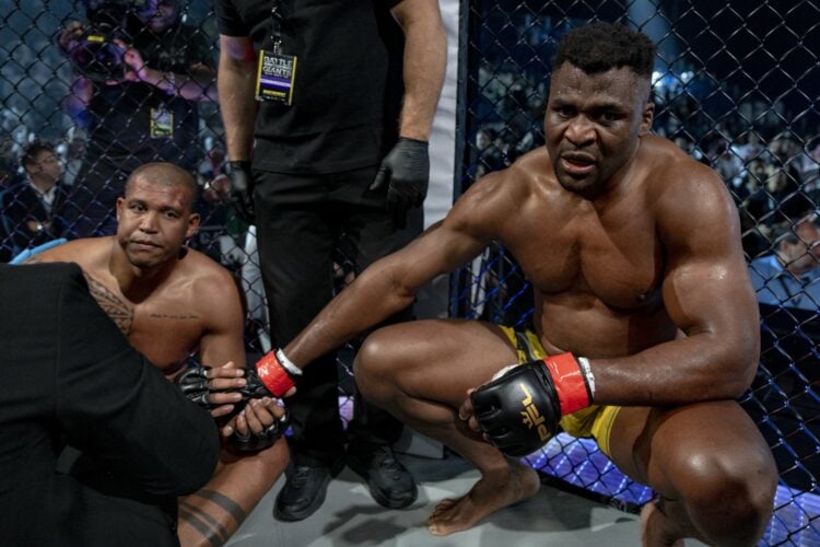 Renan Ferreira is consoled by Francis Ngnnou after getting KO'd