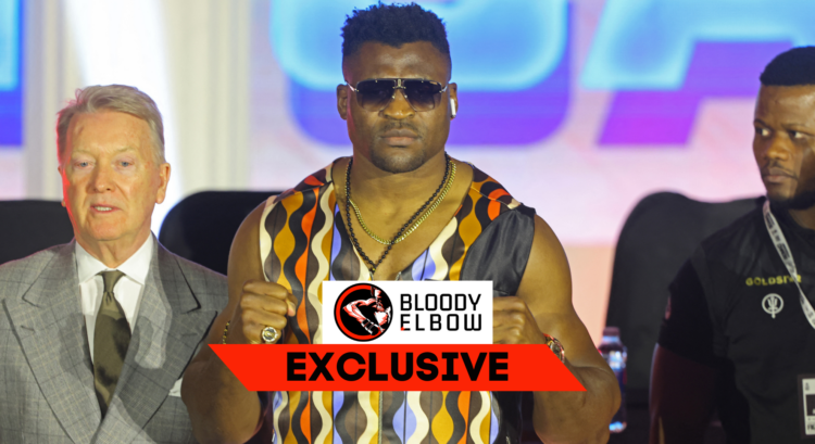 Francis Ngannou poses after a press conference